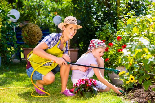 Lawn care team inspecting a garden before mowing